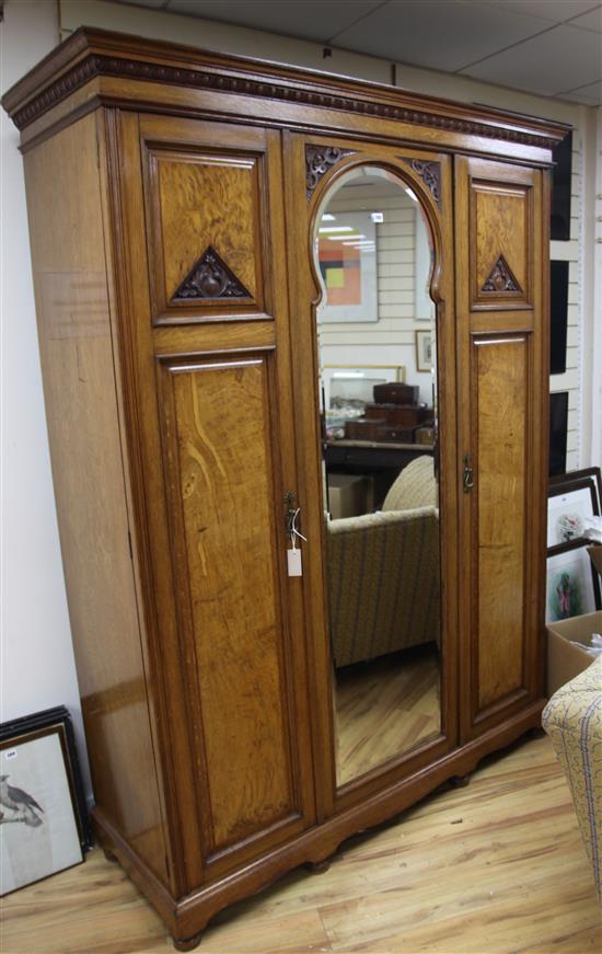 A Victorian carved oak wardrobe H.217cm
